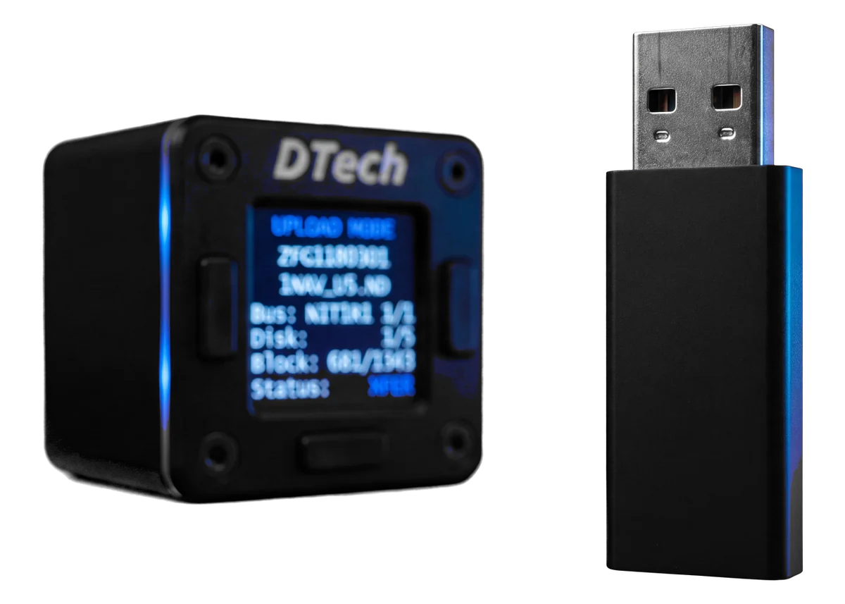 A USB flash drive in the foreground, the nanoPDL portable data loader behind it with its blue bezel light and upload display glowing
